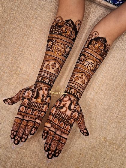 A design for an NRI bride from Canada, incorporating the Sikh Khanda symbol and the Ek Onkar symbol within a traditional bridal pattern. It's a beautiful way to blend faith with bridal artistry.