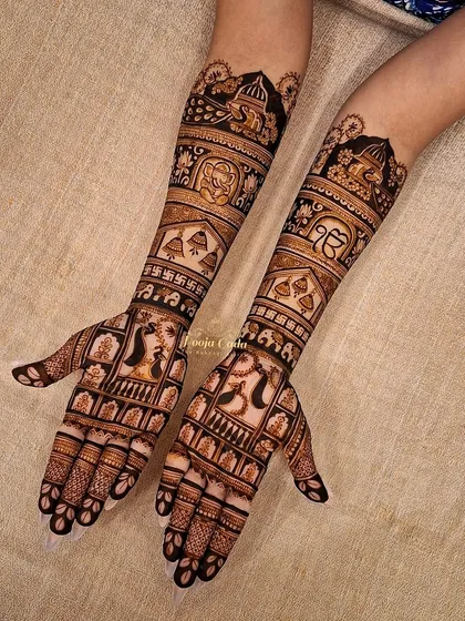 A design for an NRI bride from Canada, incorporating the Sikh Khanda symbol and the Ek Onkar symbol within a traditional bridal pattern. It's a beautiful way to blend faith with bridal artistry.