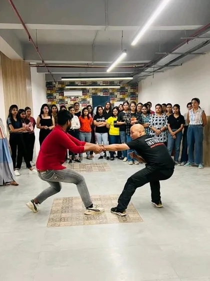 A strength and balance drill during a women's corporate workshop.