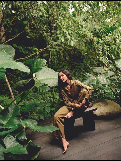 Surrounded by giant tropical leaves, the model becomes one with the jungle. This shot for AMPM highlights the collection's organic feel and connection to nature.