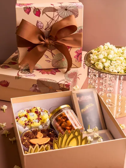 A look inside my "Abundance" Diwali hamper, filled with a variety of my festive desserts, including cake tubs, chocolates, and nuts.