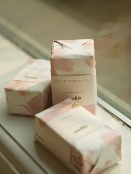 A custom order of 95 soaps for a baby announcement, wrapped in beautiful floral paper.