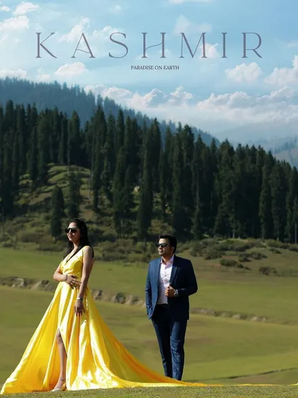 A breathtaking moment in Kashmir, where the vibrant yellow of a flowing gown contrasts beautifully with the lush green meadows and pine forests. This is the kind of epic, cinematic shot that turns your love story into a work of art. This is what I mean by destination pre-wedding photography.