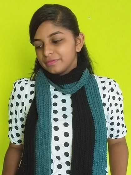 Showing one of the many ways to style my handmade crochet muffler. It's a versatile accessory for colder weather.