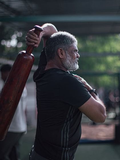 An older member with a grey beard swings a Mudgar with precision and strength. This image powerfully demonstrates that our training is for all ages and that strength is timeless.