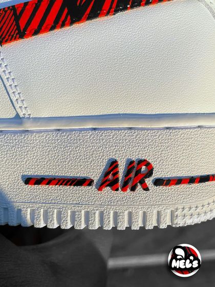 A macro shot of the patterned "AIR" logo on the midsole.