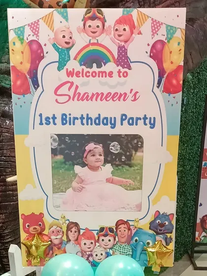 The personalized welcome sign I created for the Cocomelon themed party, featuring a photo of the birthday girl.