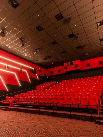 The auditorium itself is a critical part of the cinematic experience. At INOX, Rajouri Garden, the design focuses on comfort and technical excellence. The vibrant red seating and integrated wall lighting create an immersive environment that directs all attention to the screen.