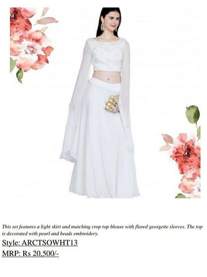 A closer look at the details of our white crop top set, showing the pearl and bead embroidery on the blouse. The flared georgette sleeves add a touch of drama to this elegant outfit.