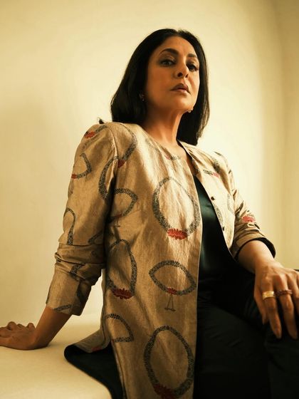 A low-angle shot that gives a powerful and commanding perspective to this elegant look.