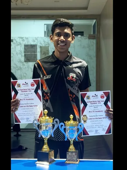 Shivam Vidhate proudly displays his two trophies after securing second place in U-19 boys and third place in U-17 boys at the 2nd District Ranking.
