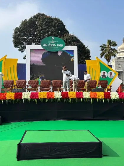 The main stage setup for the EV Expo, complete with an LED screen backdrop and floral decorations. We design and build stages that serve as a professional focal point for speakers and presentations.