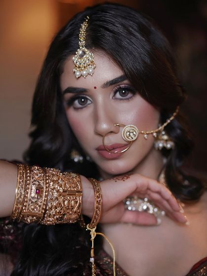A final close-up of this elegant bridal look. The focus is on her expressive eyes, enhanced with soft liner and full lashes.