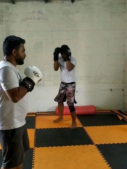 A duplicate of image 106, showing a student practicing boxing fundamentals.