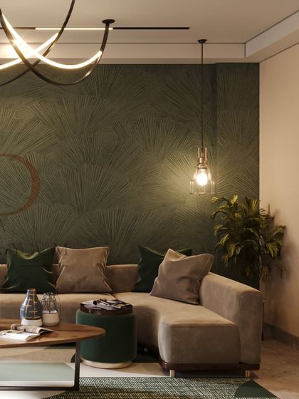 A living room with a deep green textured accent wall, a comfortable taupe sectional sofa, and modern abstract lighting.