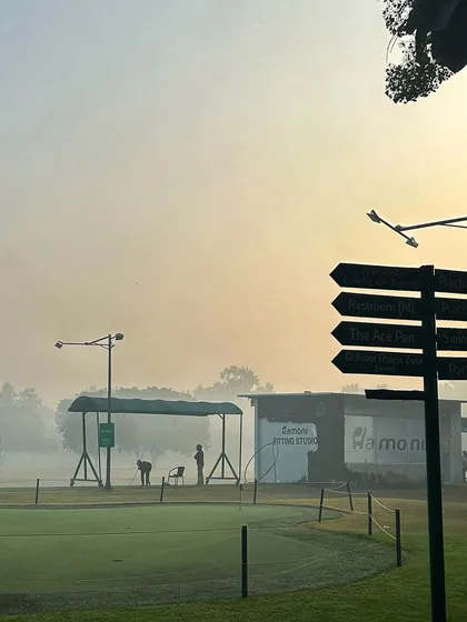 The directional sign stands against a misty morning backdrop, pointing the way to all our facilities.