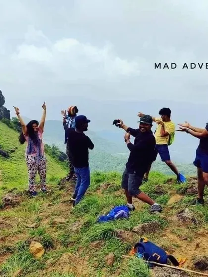 Our group celebrating at the top of a peak during the Ranipuram trek. The joy of reaching the summit is best shared.