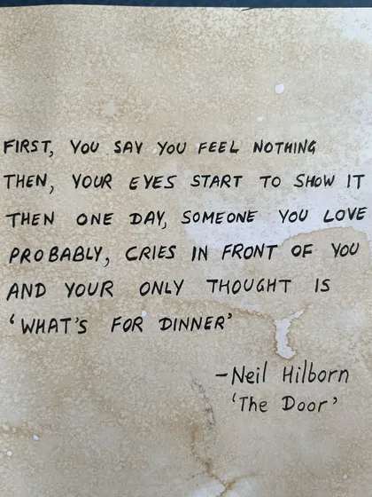 The powerful Neil Hilborn quote that inspired my journal page, handwritten on coffee-stained paper.