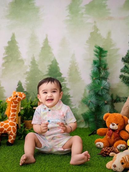 This little boy's happy smile lights up the whole jungle in this fun and adventurous themed photoshoot.