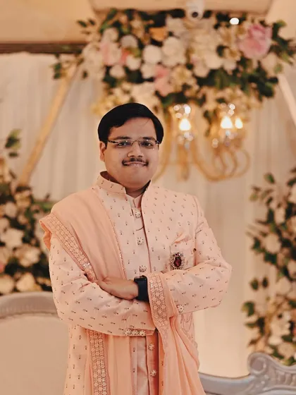 A portrait of the groom looking sharp and ready for the ceremony. We ensure both partners get their moments to shine in the wedding photos.