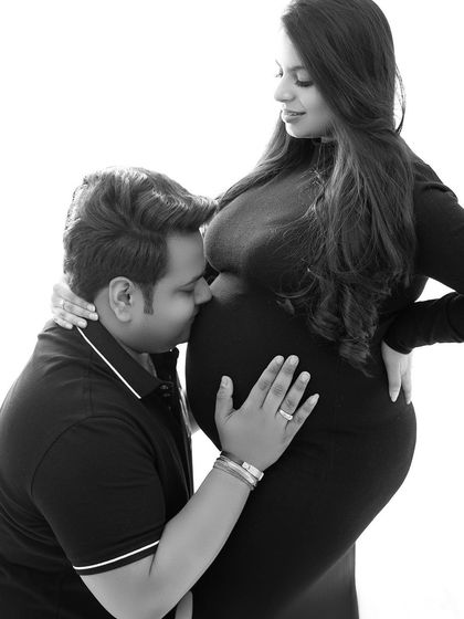 The dad-to-be sharing a sweet moment with the baby bump. I aim to capture these unscripted, loving gestures that tell your family's story.