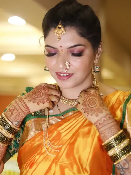 Creating the perfect Maharashtrian bridal look is all about the details. Here, I've focused on a flawless base and defined eyes that highlight the traditional 'nath' and other jewelry, ensuring the bride looks authentic and beautiful.