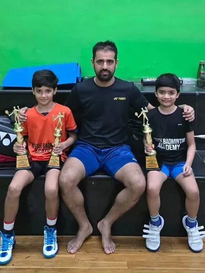 Celebrating our state champions. I am incredibly proud to mentor young talents and guide them to victory. Here I am with two of our doubles state champions, who have a very bright future ahead of them.