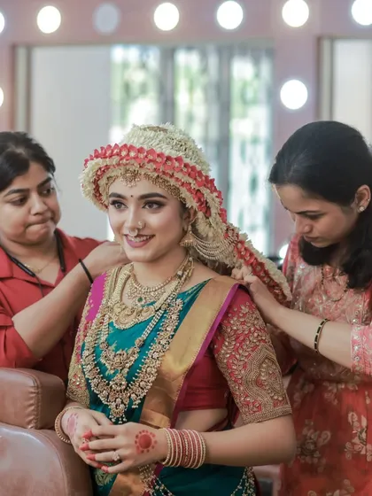 A behind-the-scenes look at the meticulous process of creating the Sharadha Jalli hairstyle, showing the teamwork and artistry involved.