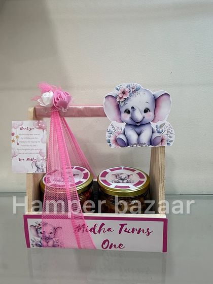A single view of the elephant-themed hamper for Midha, showing the personalized nameplate and thank you card.