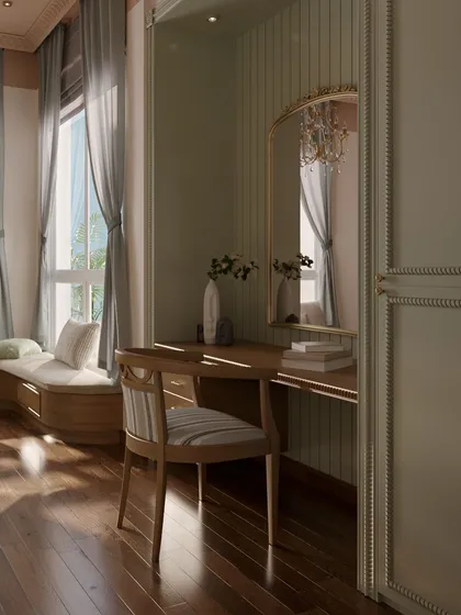Sunlight streams into the room, highlighting the beautiful wood grain of the flooring and the delicate details of the vanity chair and mirror.