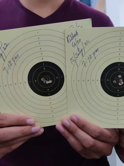 A perfect 100/100 series from our student Rishabh. This close-up shows the tight grouping of shots, a key indicator of a stable and consistent shooting technique.