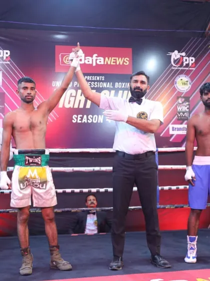 The referee raises the hand of the winner. This is the moment that makes all the hard training worthwhile.