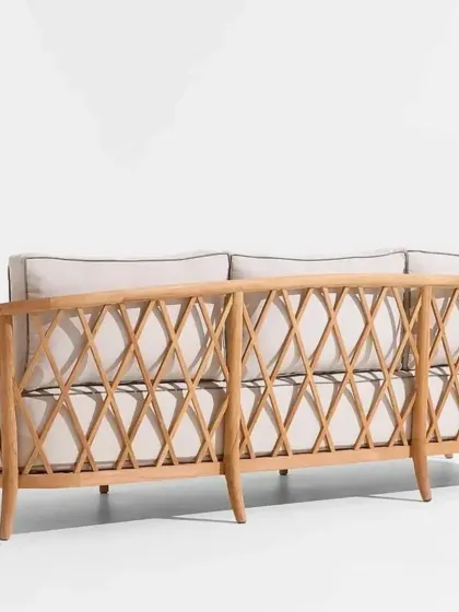A detailed view of the back of our lattice-patterned sofa, showcasing the clean lines and expert joinery. This design is equally beautiful from every angle.