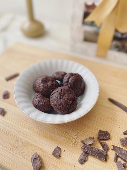 A beautifully styled shot of our double chocolate wheat cookies, a popular item in our festive gift collections.