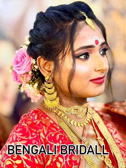 I specialize in creating authentic regional bridal looks. Here is a beautiful Bengali bride, complete with the traditional bindi and chandan design, paired with classic eye makeup and a bold red lip.
