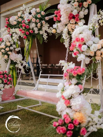 The Mehendi ceremony should feel relaxed and beautiful. I designed this jhoola (swing) to be a perfect photo spot, enveloping it in lush pink and white roses to create a romantic, garden-like atmosphere.