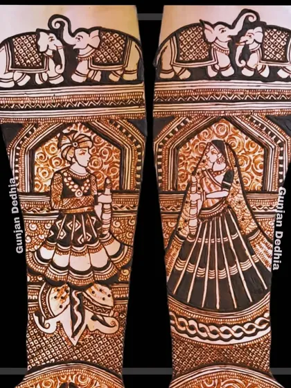 A regal depiction of a bride and groom in traditional attire. The top of the arms features elephants, symbolizing strength and good fortune for their marriage.