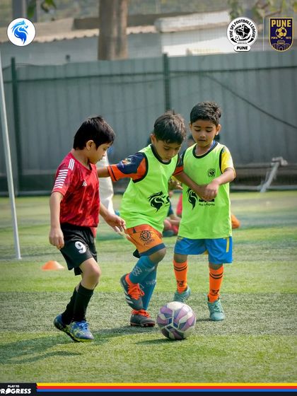 Even our youngest players in Pune show incredible focus. Here, three players are locked in a battle for the ball.