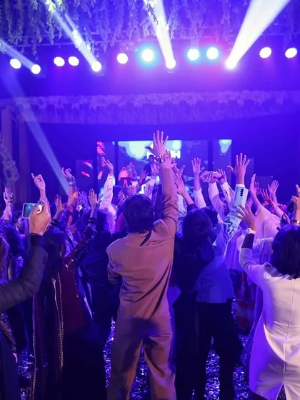 This is what a successful Sangeet night looks like. A packed dance floor, hands in the air, and everyone lost in the music. We create the vibe, you make the memories.