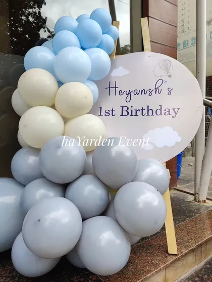 A personalized welcome sign for a hot air balloon themed first birthday party.