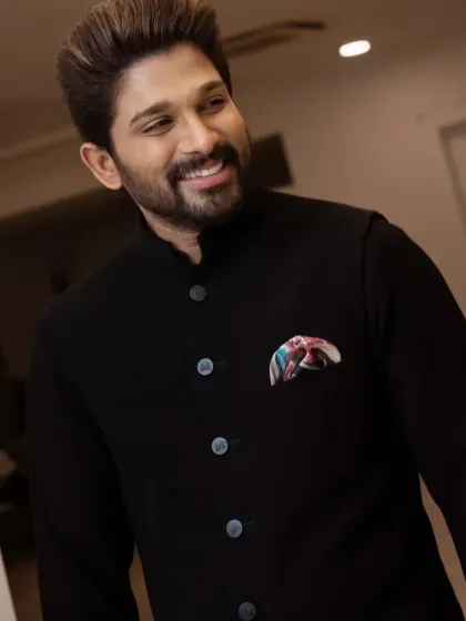 A close-up of Allu Arjun in the classic black Jodhpuri, showing the perfect fit and clean lines.