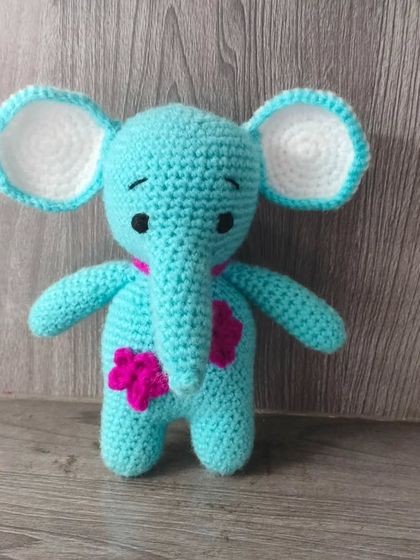This handmade crochet elephant is washable and plastic free. A safe and durable toy for any child.