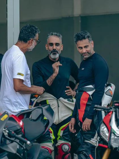 The conversations in the paddock are just as important as the time on track. Here, riders and instructors share insights and experiences.