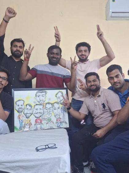 The real-life crew with their caricature counterparts! It's amazing to see the group of friends so happy with their personalized artwork. This is what it's all about.