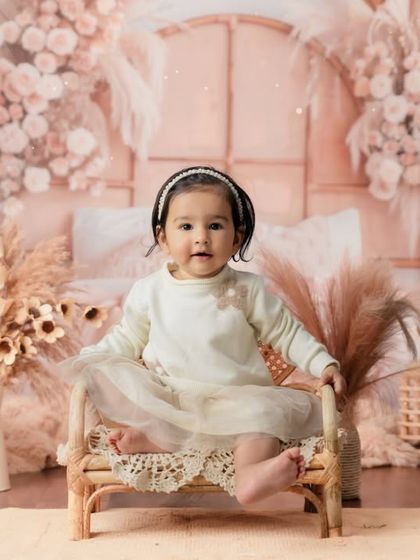 A beautiful and soft boho-chic setup with dried flowers and pampas grass, creating a gentle and stylish portrait.