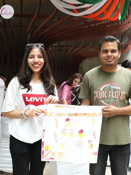 Another pair of participants with their finished piece from the block printing session. Each creation is unique, reflecting the personal touch of our guests.