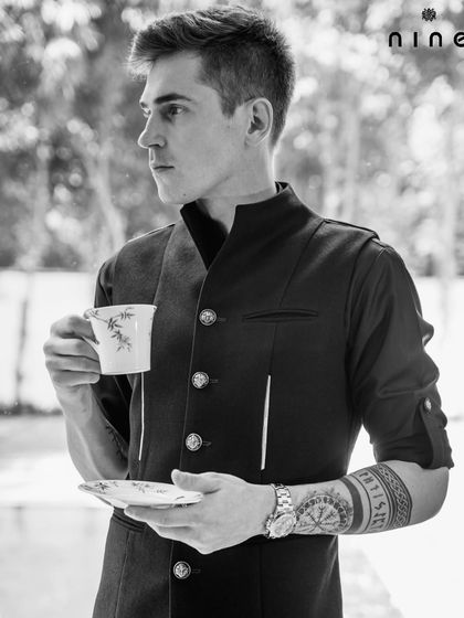 The details matter. This shot highlights the unique button placement and layered structure of our "Metal Bling" kurta, designed for the man who appreciates a modern aesthetic.