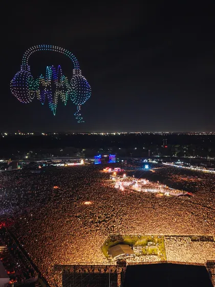 This is what it looks like when I fill the sky with art for over 300,000 fans at a major music festival. I create massive, dynamic visuals like these animated headphones that become a core part of the event's atmosphere.