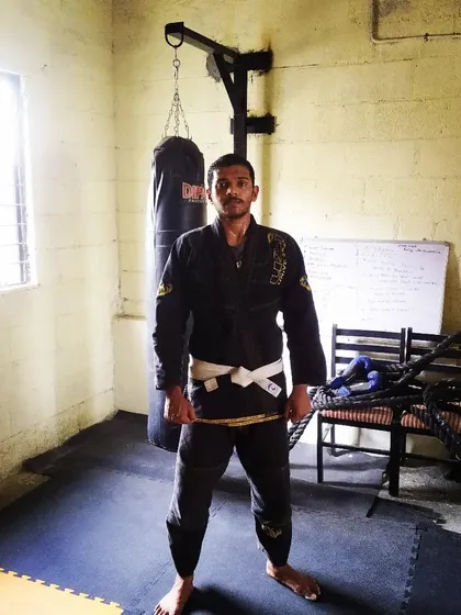 In my Gi at Sai MMA Academy. I carry the mindset of a white belt, always open to learning, no matter the color of the belt around my waist.