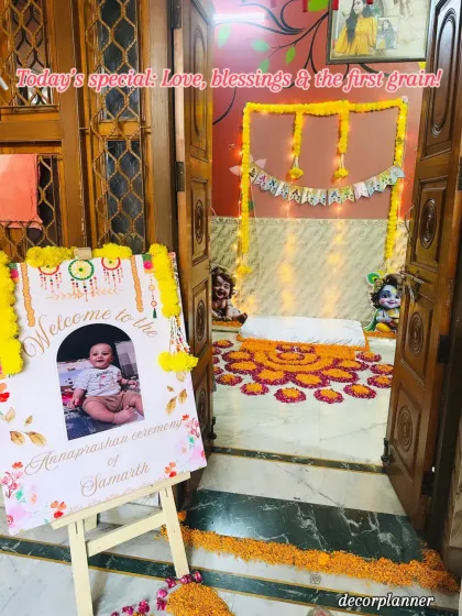 The entrance to the Krishna-themed Annaprashan, featuring a personalized welcome sign. This view shows how the decor flows from the doorway into the main ceremony space, creating a cohesive experience.